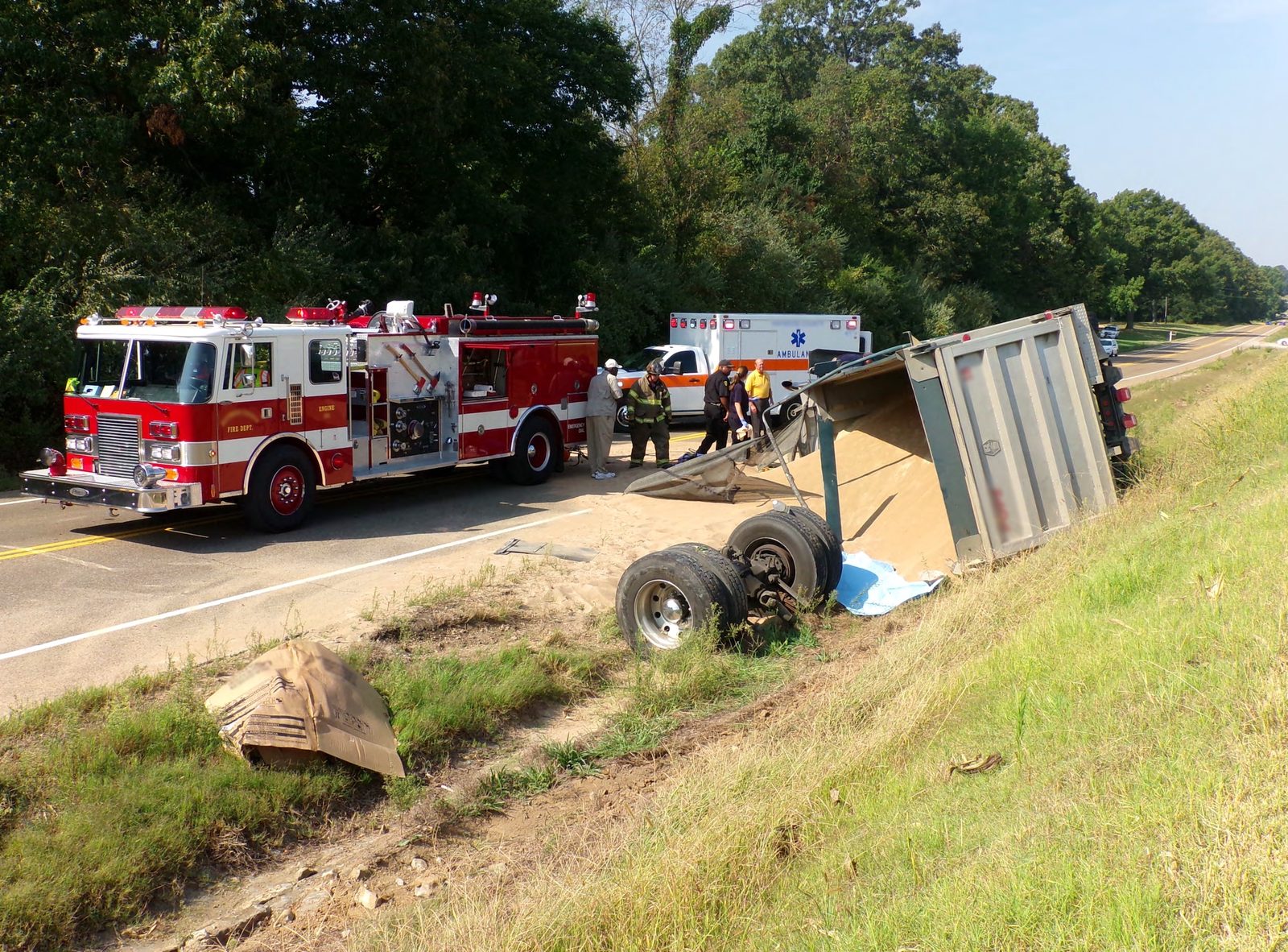 A vehicle with severe rear-end collision damage on a Texas roadway