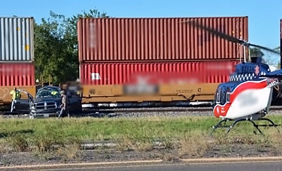 Emergency responders and an ambulance at the scene of a serious highway truck accident